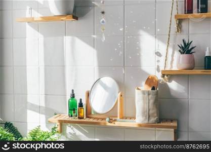 Sun catcher crystal making many sum beams and light spots on white tile wall at sunny day. Modern eco friendly bathroom with minimalistic biophilic design. Sun catcher crystal making many sum beams and light spots on white tile wall