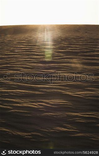 Sun coming down over a sand dune, no people, landscape,