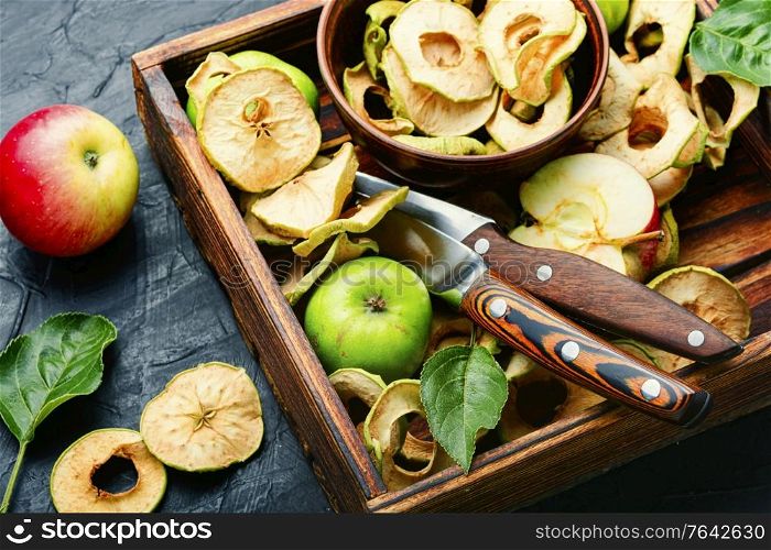 Sun-dried apple slices or apple chips and fresh apple.Dried fruits. Dried apple rings