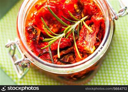 sun dried tomatoes in a glass jar
