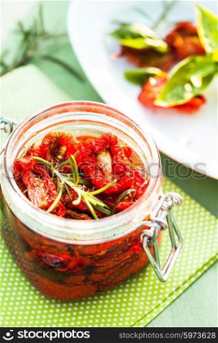 sun dried tomatoes in a glass jar. sun dried tomatoes