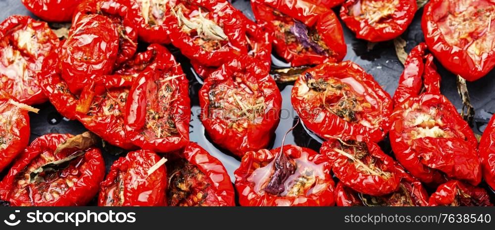 Sun dried tomatoes with herbs and spices. Sun dried tomato halves