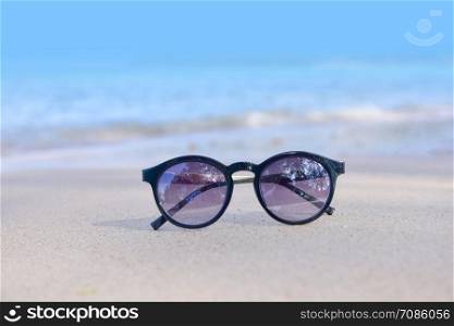 Sun Glasses on Beach at Sea And Sunset Background Summer Holidays