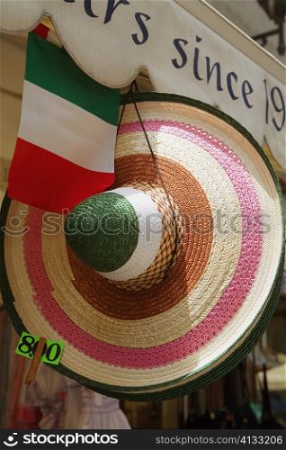 Sun hat hanging at a market stall, Sorrento, Sorrentine Peninsula, Naples Province, Campania, Italy