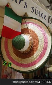 Sun hat hanging at a market stall, Sorrento, Sorrentine Peninsula, Naples Province, Campania, Italy