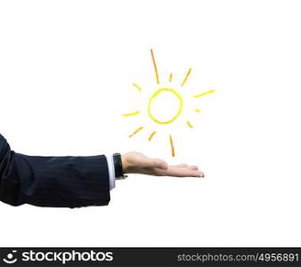 Sun in hand. Businessman holding sun in palm. Close up image