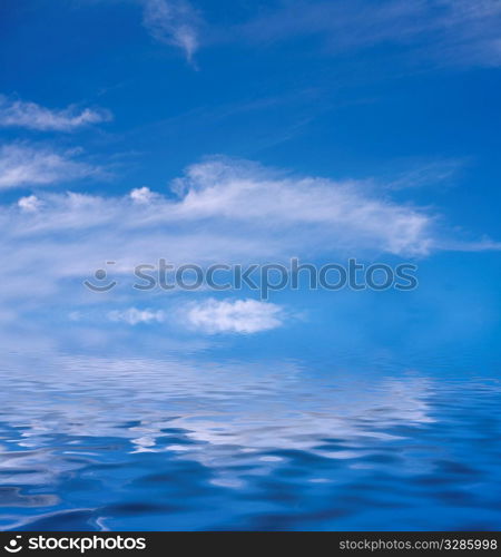 Sun in the sky covered with clouds and sea