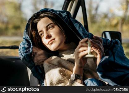 sun kissed woman holding cup coffee