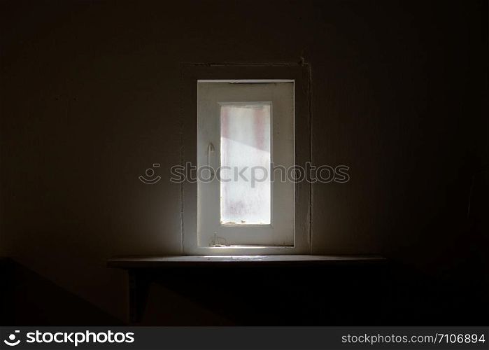 Sun light through window into dark room