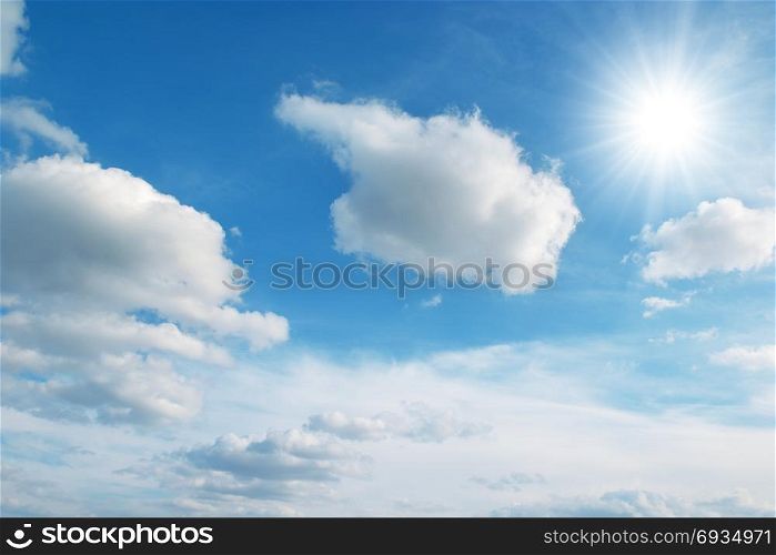 sun on blue sky and clouds