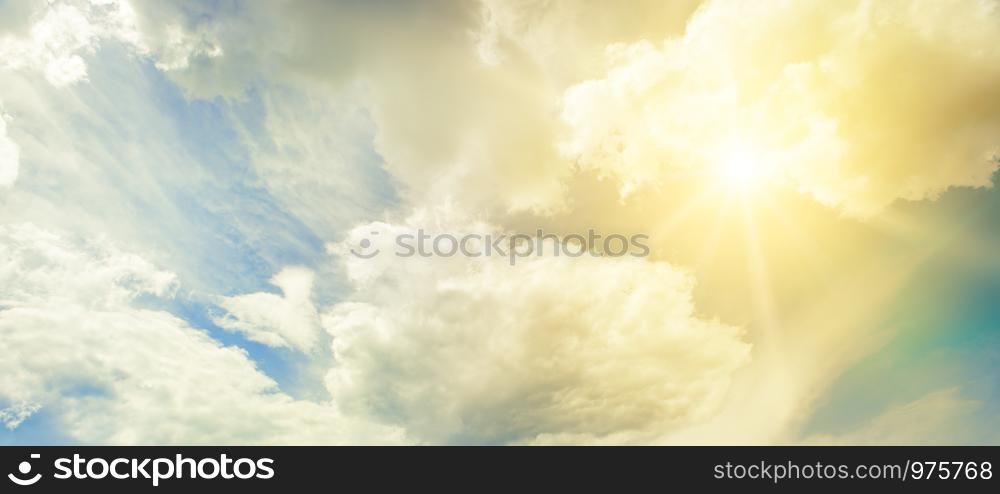 Sun on blue sky with beautiful white clouds.