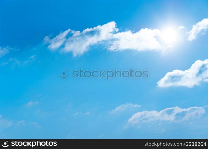 Sun on the blue sky with clouds. Sun on the blue sky