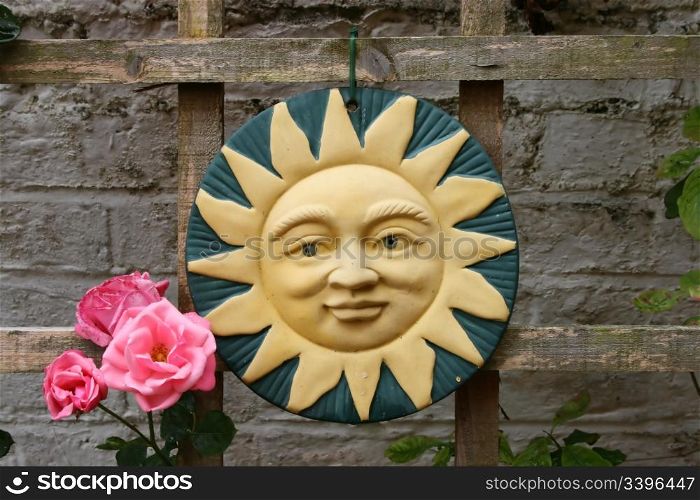 Sun ornament and rose