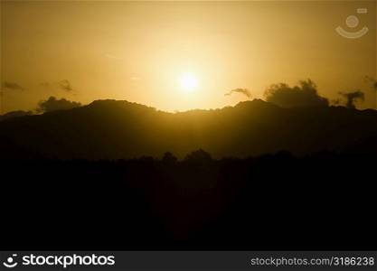 Sun over a mountain range, Nawiliwili Beach Park, Kauai, Hawaii Islands, USA