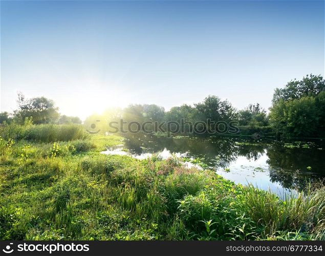 Sun over the river in the morning