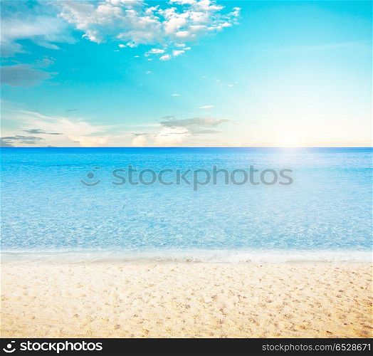 Sun over tropical beach. Sun over tropical beach. Summer vacations outdoor scene. Sun over tropical beach