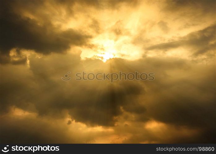 sun rays through cloudy sky, hope or opportunity concept, warm tone effect