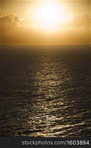 Sun reflected on ocean in Maui, Hawaii.