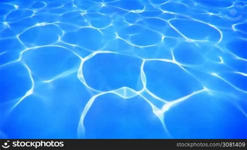 Sun reflections on a slowly moving blue water surface