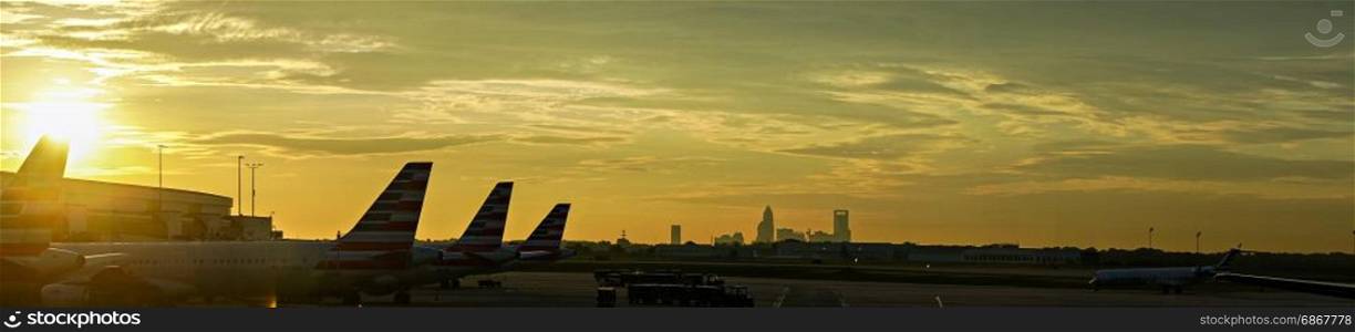 sun rising early morning over charlotte skyline seen from clt airport