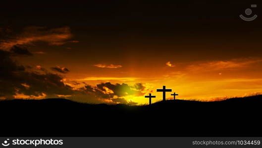 Sun rising on three Christian crosses.