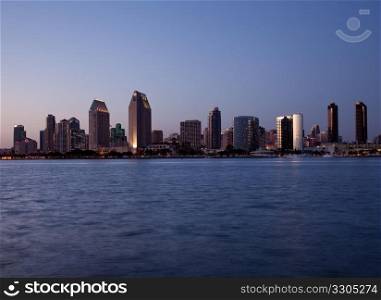 Sun setting lights up the buildings on San Diego seafront