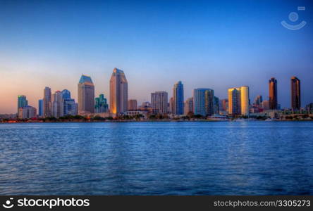 Sun setting lights up the buildings on San Diego seafront in HDR