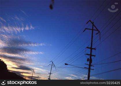 Sun Setting on Telephone Poles