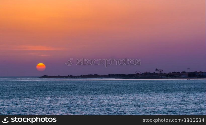 Sun setting over the atlantic ocean near the shores of Dakar, Senegal