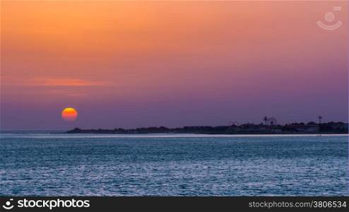 Sun setting over the atlantic ocean near the shores of Dakar, Senegal