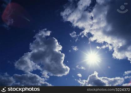 Sun Shining Brightly In A Cloudy Sky