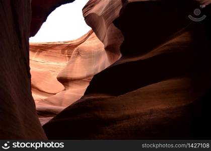Sun shining on Antelope Canyon&rsquo;s red rock walls.