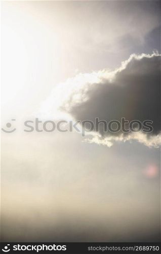 sun shining through cloud