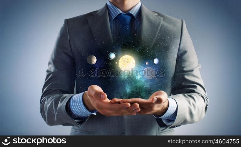 Sun system. Close up of human hand with planet of sun system