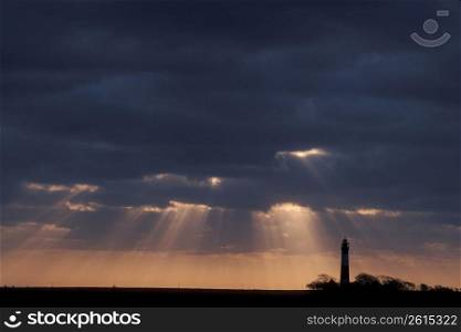 Sunbeams and lighthouse, Baltic Coast, Germany