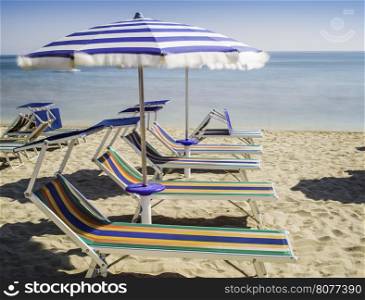Sunbeds and umbrellas on the beach.