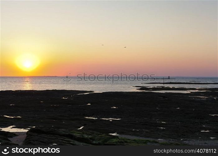 sundown over Atlantic ocean near Piriac-sur-Mer town on Guerande Peninsula, France