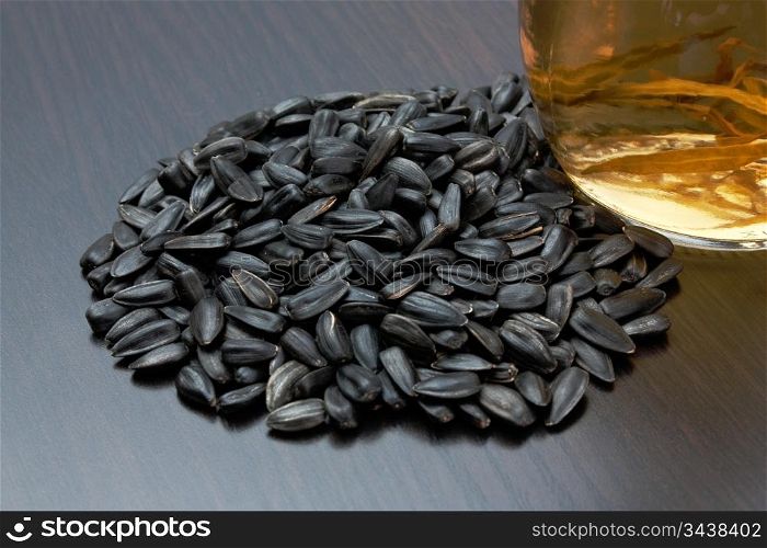 sunflower seeds and a bottle of oil