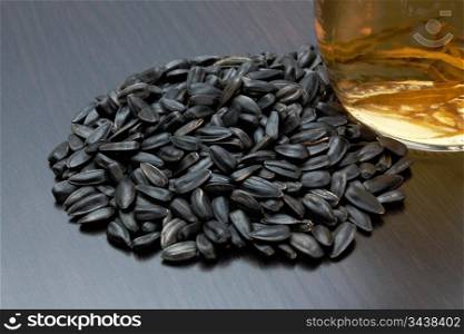 sunflower seeds and a bottle of oil
