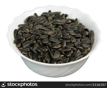 Sunflower seeds in a plate on white background, isolated
