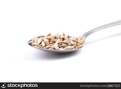 Sunflower seeds on spoon