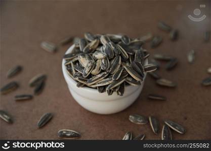Sunflower seeds on wood background