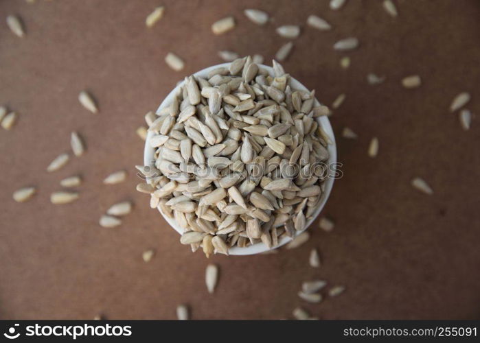 Sunflower seeds on wood background