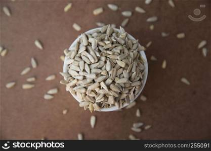 Sunflower seeds on wood background