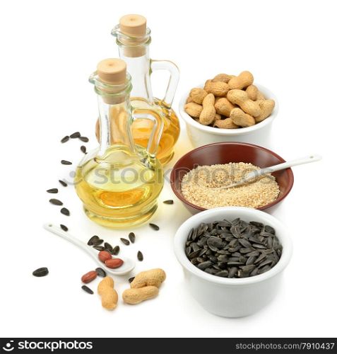 Sunflower seeds, peanuts and oil isolated on a white background