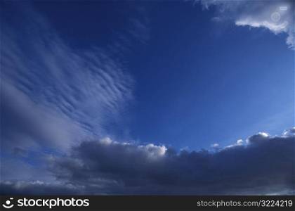 Sunlight And Layers Of Clouds In Blue Sky