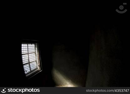 Sunlight entering a dark room through a window