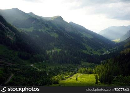 Sunlight in dark valley in Lichtenstein