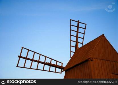 Sunlit old traditional windmill at the Swedish island Oland in the Baltic Sea