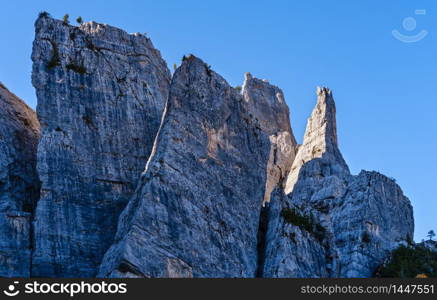 Sunny autumn alpine Dolomites rocky mountain scene, Sudtirol, Italy. Cinque Torri (Five pillars or towers) rock famous formation. Picturesque traveling, seasonal, hiking, nature beauty concept scene.